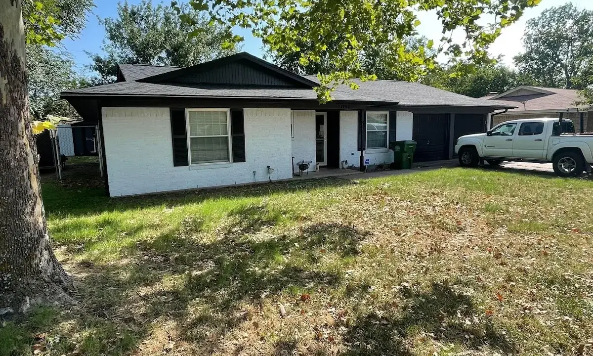 Professional roofing crew working on a residential roof in Marion